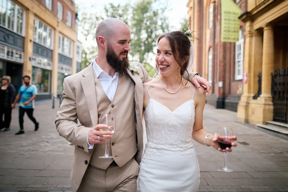 A newly married couple enjoying a walk through Norwich