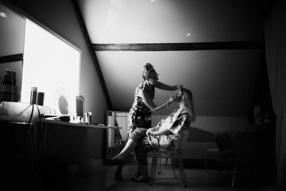 A quiet black-and-white moment during wedding preparations